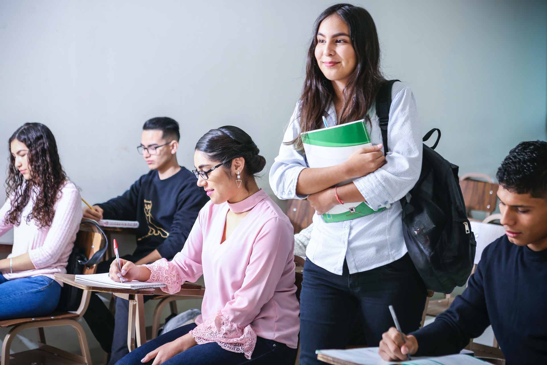 Students in a classroom, sitting at their desk